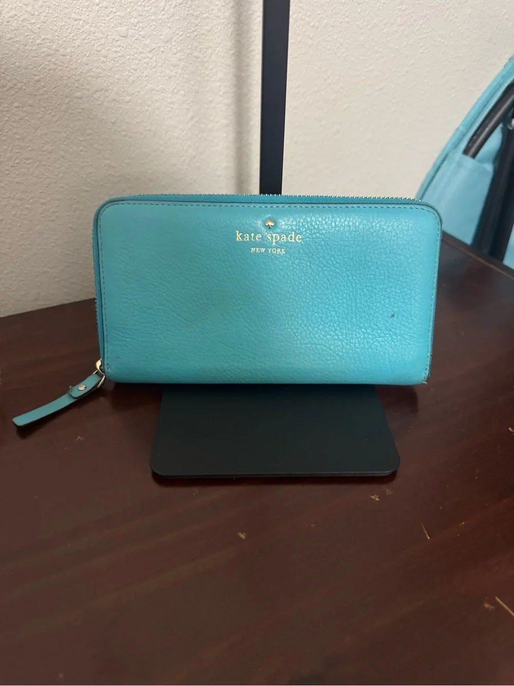 kate spade teal zip-around wallet with cream interior